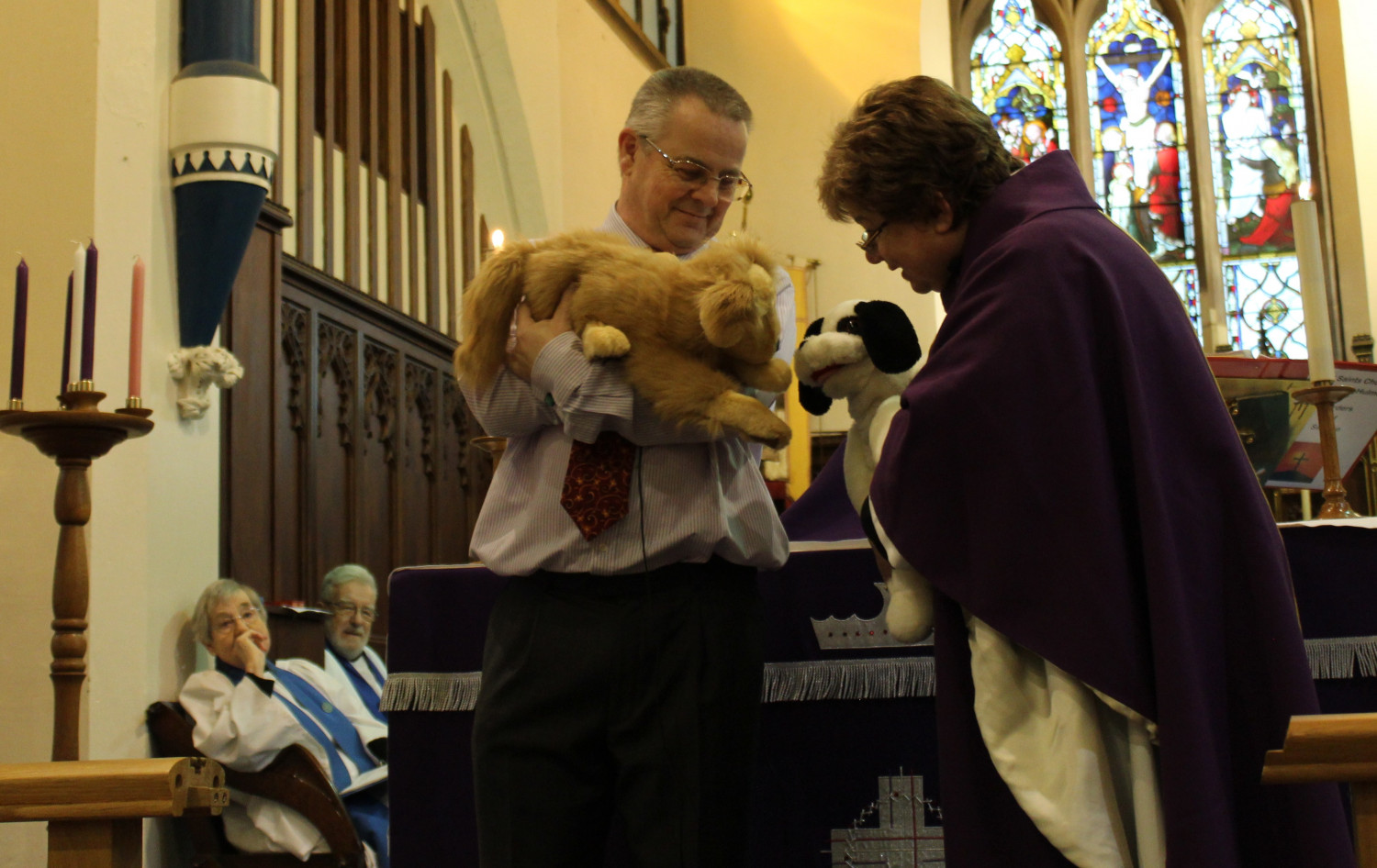 Peter with the new parish pup and Janet Bacon with Abel