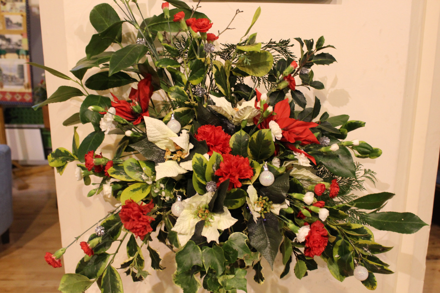 photo of christmas flower arrangement in red and white
