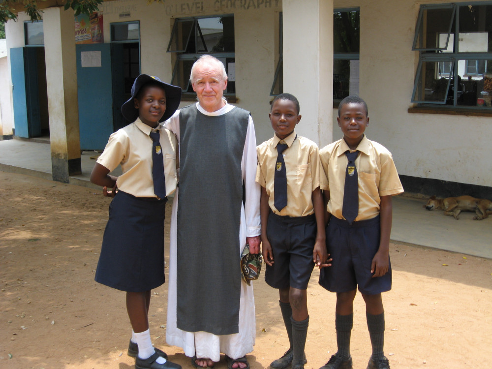 Father Nicolas Stebbing and children supported by Tariro